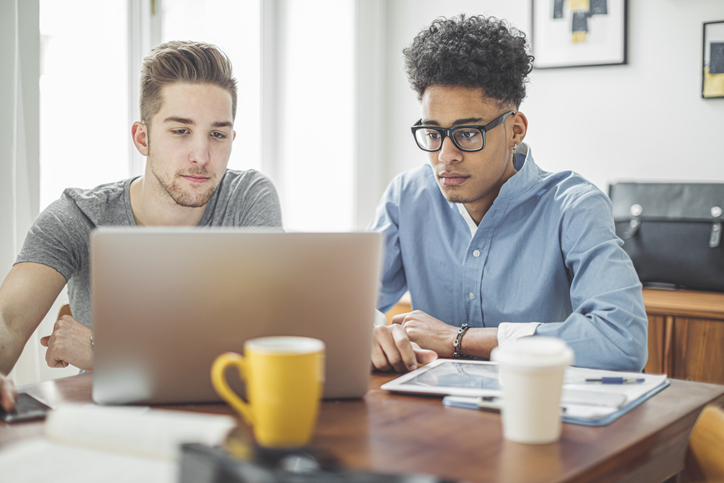 A couple filing their taxes online.